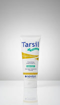 Tarsil shampoo bottle with Novion branding on a gray background